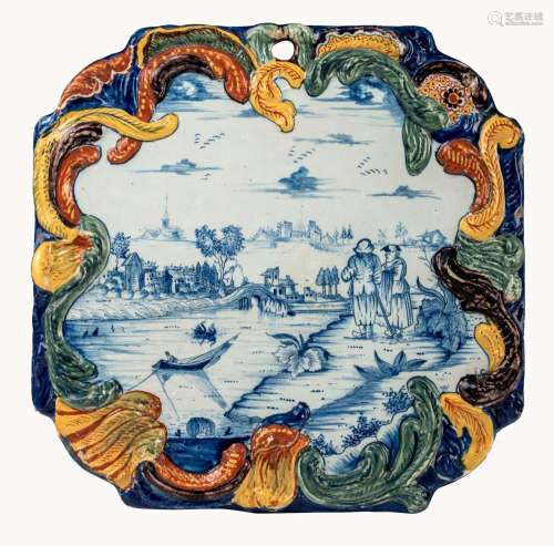 A Rococo Dutch Delft plaque depicting a pastoral scene near ...