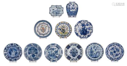 A collection of Delft items, containing nine chargers, a chi...