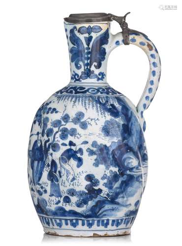 A large blue and white Delft jug with a chinoiserie decorati...