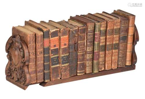 A various collection of 17th and 18thC books, presented in a...