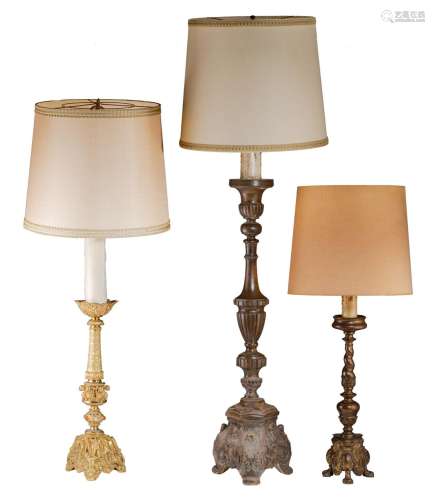 A collection of three floor candlesticks, transformed into f...