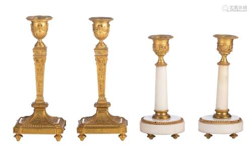 Two pairs of Neoclassical candlesticks, H 17,5 - 21 cm
