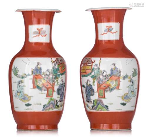 A decorative pair of Chinese coral-red ground vases, with a ...