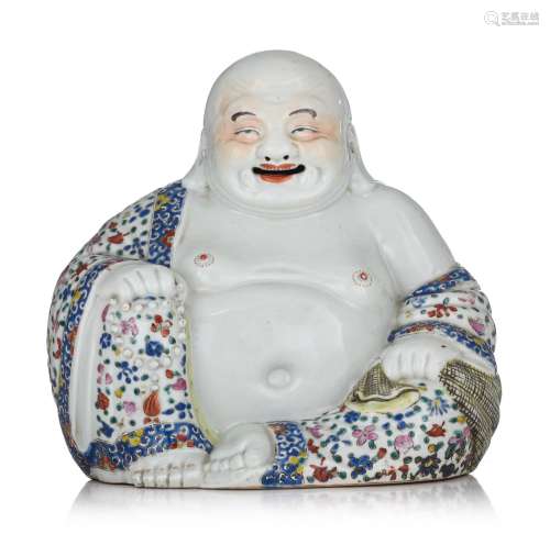 A Chinese famille rose figure of a smiling Budai, with an im...