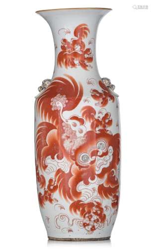 A Chinese iron-red vase, paired with Fu lion handles, with a...