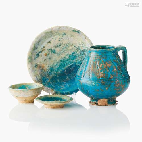 A Persian Turquoise Glazed Jug and Three Persian Dishes