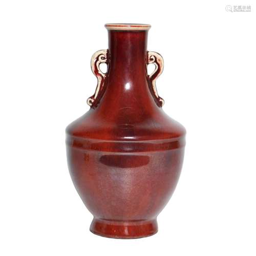 A RED-GLAZED VASE