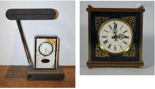 A) Moderne Uhr mit Lampe. H. 46, 5 cm. Schwarz gefasstes Met...