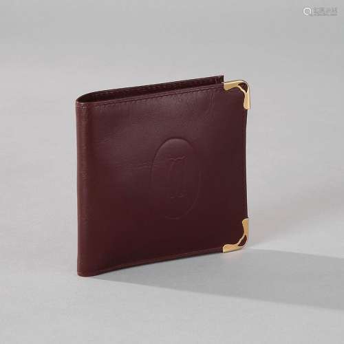 CARTIERPortefeuilleen cuir bordeaux.10.5 x 11 cm.A wallet in...