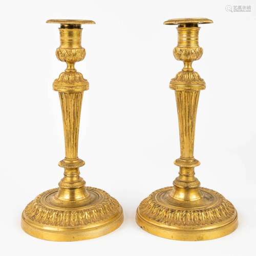 A pair of candlesticks made of gilt bronze in Louis XVI styl...