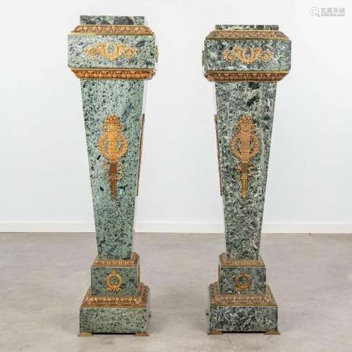 A pair of marble pedestals mounted with bronze in empire sty...