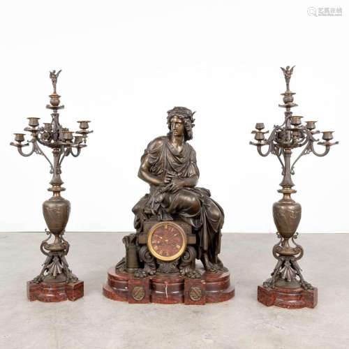 A three-piece mantle garniture clock in neoclassical style, ...