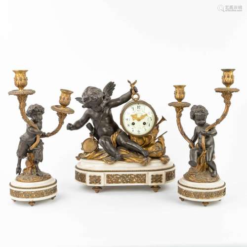 A three-piece mantle garniture, consisting of a clock with 2...