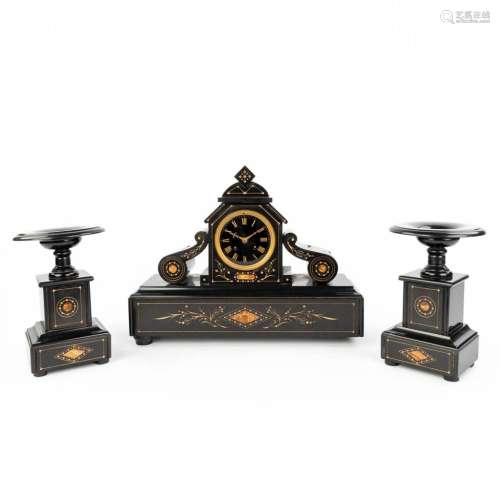 A three-piece mantle garniture clock and side pieces made of...