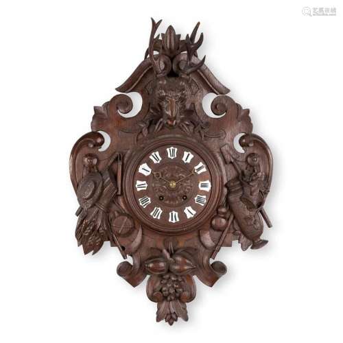 A cartel clock 'Black Forest' made of sculptured wood, with ...