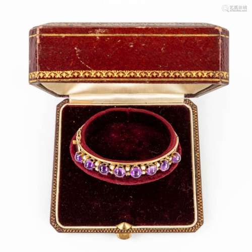 An antique bracelet, decorated with purple and white semi-pr...
