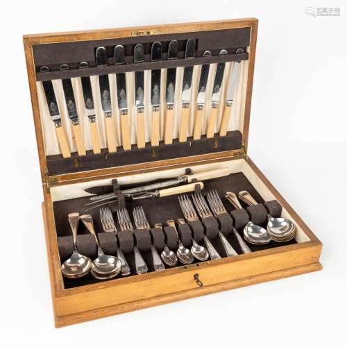 A vintage silver-plated cutlery in a wood chest. Made in the...