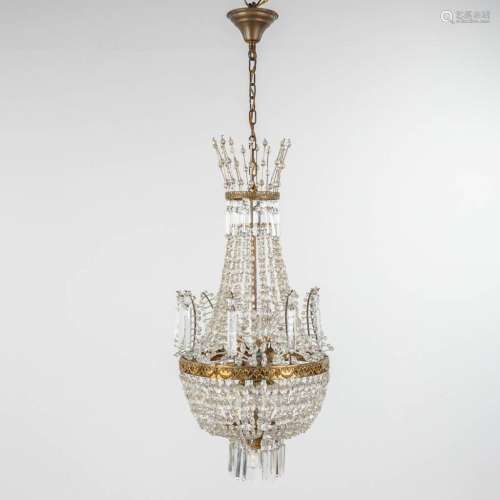 A chandelier 'Sac A Perles' decorated with tiny ram's heads....