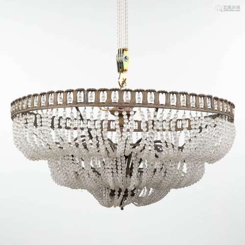 A large chandelier 'Sac A Perles' made of brass and glass. (...