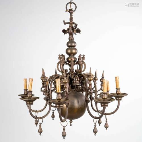 A large Flemish chandelier made of bronze, decorated with a ...