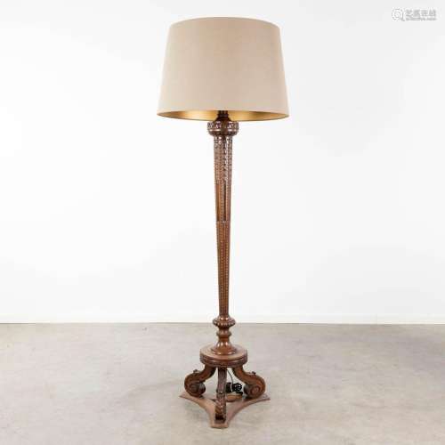 A wood sculptured standing lamp, circa 1920. (L:42 x W:42 x ...