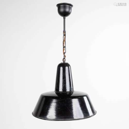 An industrial hanging lamp, with a black and white enamelled...