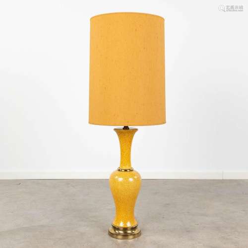 A vintage table lamp made of ceramics with bronze and an ora...