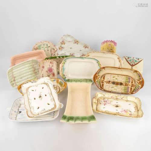 A collection of antique asparagus plates, made of glazed cer...