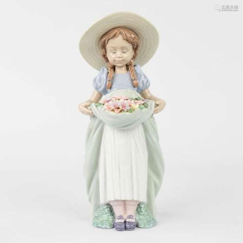 Lladro 'The Girl with Flowers' a statue, glazed porcelain (H...