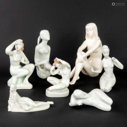 A collection of 7 ceramic figurines of naked ladies (H:25 cm...