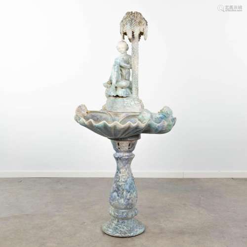 A fountain, made of glazed ceramics and finished with angels...