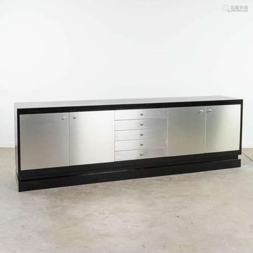 DeCoene, a large sideboard finished with polished metal. Cir...