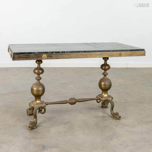 A mid-century coffee table made of bronze with a green marbl...