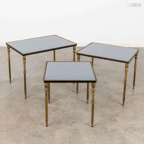 A collection of 3 cigogne side tables made of brass and glas...