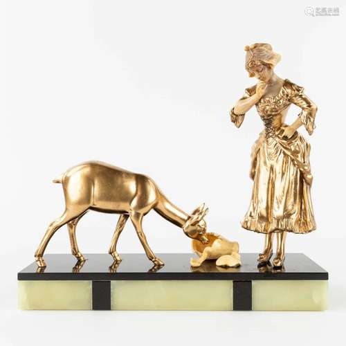 Lady and a deer, a statue made in art deco style. Spelter an...