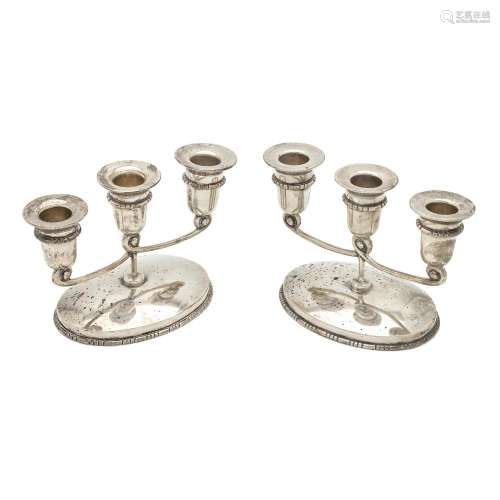 A PAIR OF MEXICAN STERLING SILVER THREE-LIGHT CANDELABRA, HE...