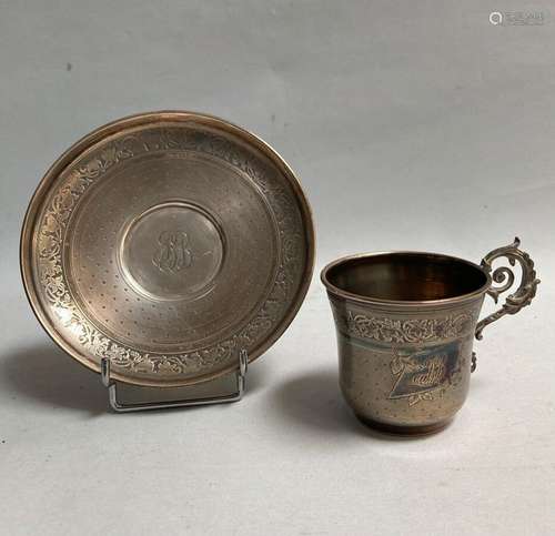 TASSE et sa SOUCOUPE en argent à décor amati, chiffrées<br /...