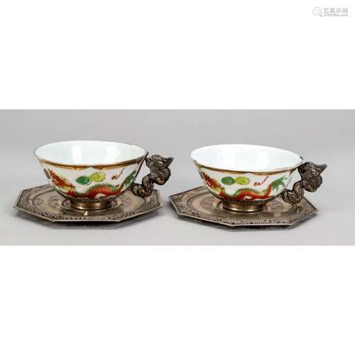 Two tea cups with saucers, pro