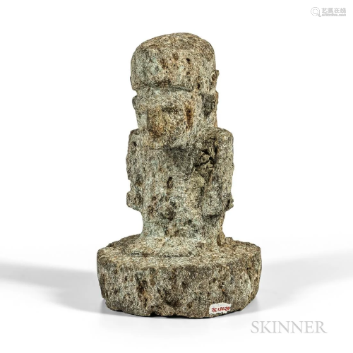 Solomon Islands Stone Figure, the male figure, standing on a...