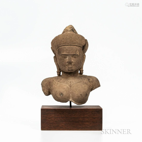 Fragment of a Sandstone Bust of Vishnu, Khmer-style, with el...