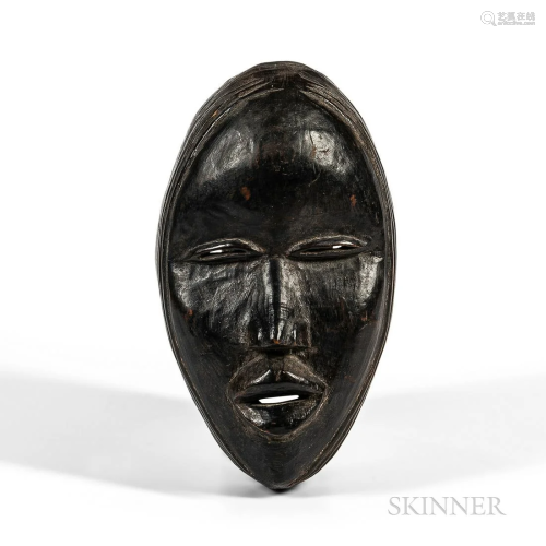 Dan Mask, Ivory Coast, hollowed-out oval form, the full prot...