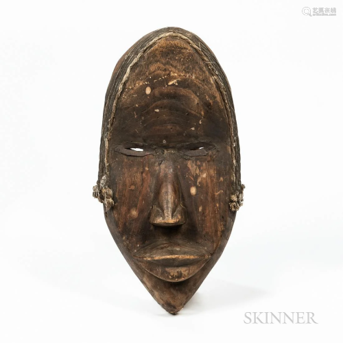 Dan Mask, hollowed-out form, pierced in the rim, with full p...