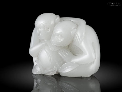 A WHITE JADE CARVING OF TWO MONKEYS WITH A PEACH CHINA, POSS...