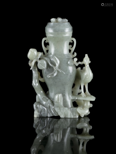 A JADE CARVING OF A LIDDED VASE TOGETHER WITH A PHOENIX CHIN...