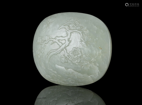 A CELADON JADE ‘PLUM AND BUTTERFLY’ ELEMENT OF A BELT BUCKLE...