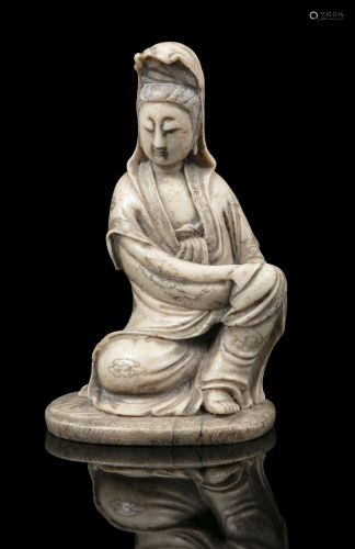 A SOAPSTONE CARVING OF A SEATED GUANYIN CHINA, QING DYNASTY ...