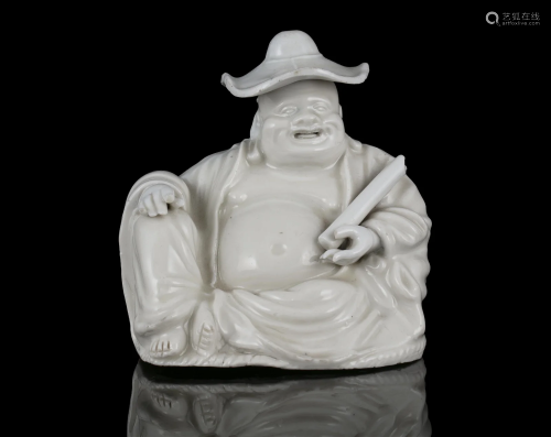 A BLANC DE CHINE / DEHUA PORCELAIN MODEL OF A SEATED BUDAI W...