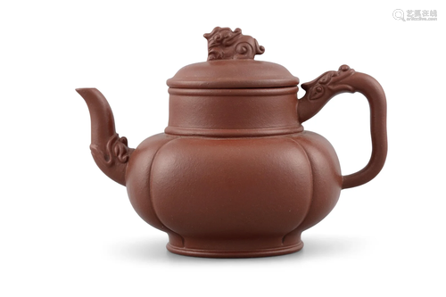 *A TIBETAN STYLE YIXING ZISHA TERRACOTTA TEAPOT AND COVER PO...