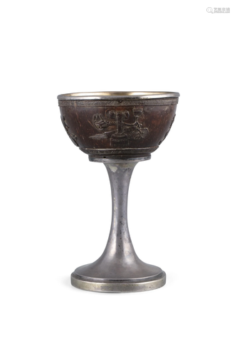 A PARCEL GILT SILVER CHALICE EMBELLISHED WITH COCO WOOD PANE...