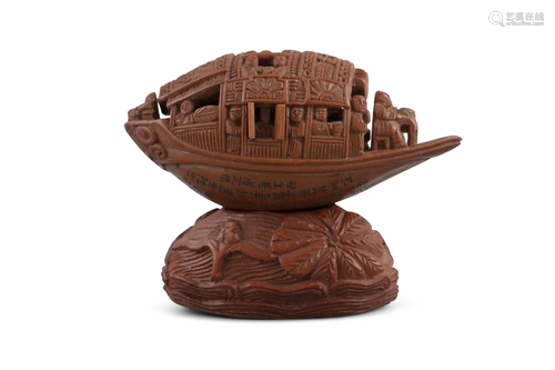 AN OLIVE PIT CARVING OF A 'PLEASURE BOAT' IN THE M...